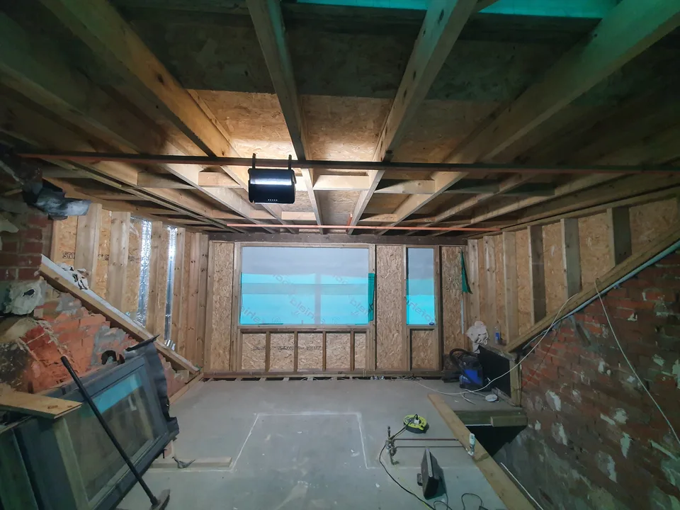 Exposed structural timbers inside an extension