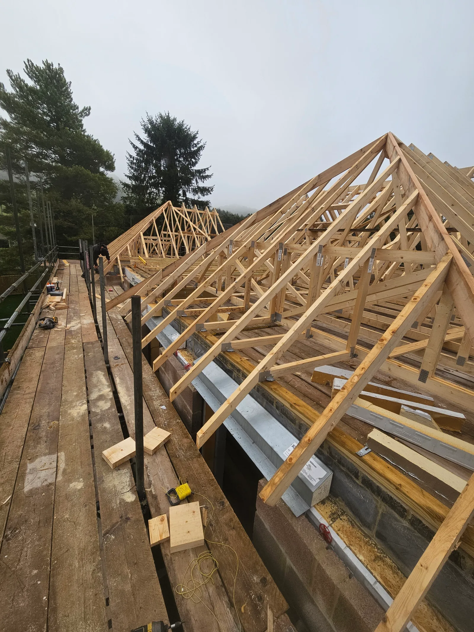 Hand-cut timber roof frame during construction